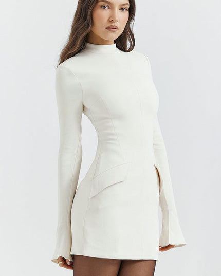 Side view of a cream mock neck long sleeve mini dress with ruffle cuffs, highlighting the fitted bodice and skirt.