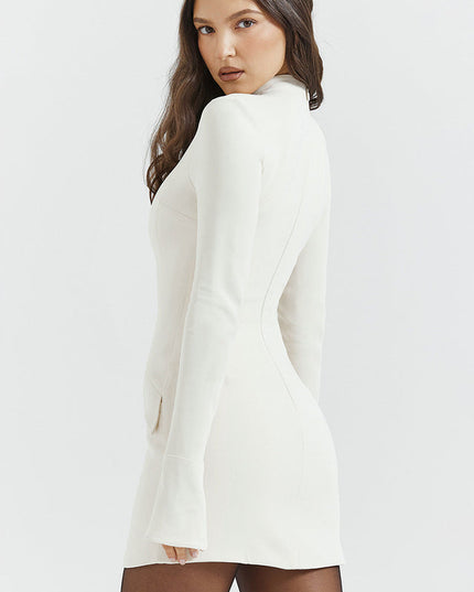 Cream mock neck long sleeve mini dress with ruffle cuffs and structured bodice, viewed from a slight angle.