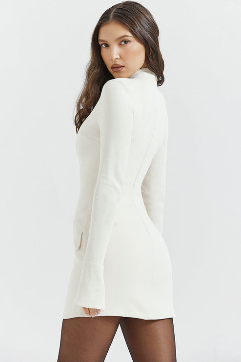 Cream mock neck long sleeve mini dress with ruffle cuffs and structured bodice, viewed from a slight angle.