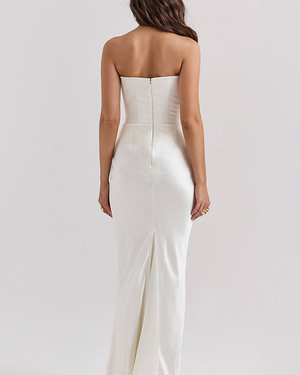 Back view of a white off-shoulder bustier maxi dress, highlighting the straight back and subtle train.