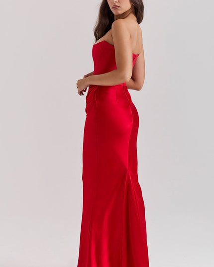 Side view of a red off-shoulder bustier maxi dress, showing the smooth fabric and subtle back detail.