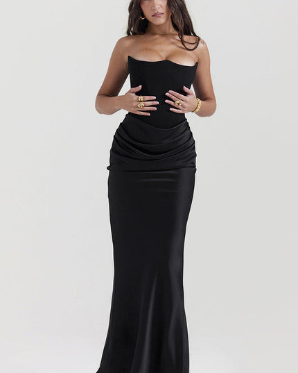Front view of a black off-shoulder bustier maxi dress, showing the draped satin skirt and fitted bodice.