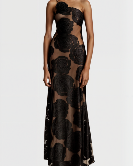 Front detail of the black rose floral maxi dress, showing the intricate one-shoulder design and sheer fabric.