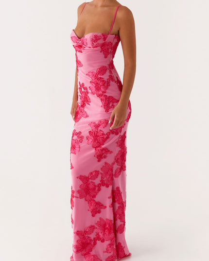 Women's pink floral maxi dress with sweetheart neckline and thin straps, full length view, slightly angled.