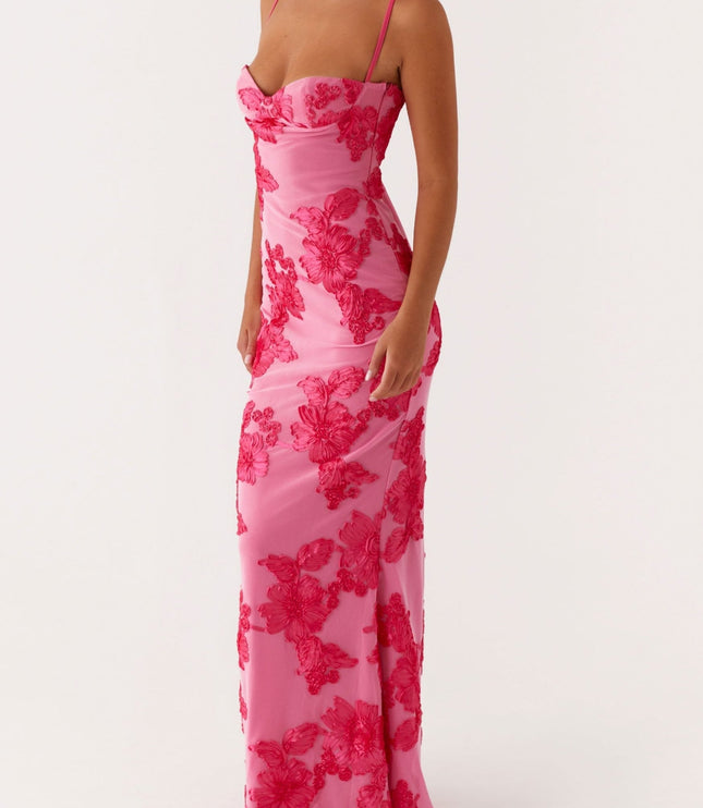 Women's pink floral maxi dress with sweetheart neckline and thin straps, full length view, slightly angled.