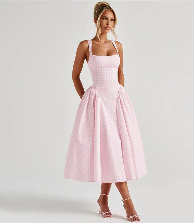Side profile of women's pink gingham square neck midi dress, showing full skirt and fitted bodice