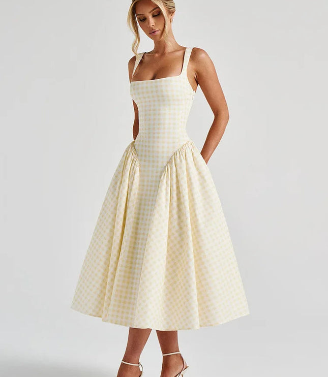 Women's light yellow gingham square neck midi dress with full skirt and fitted bodice, styled with white heels