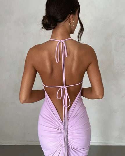 Back view of a light purple pleated plunge neck backless maxi dress with delicate tie straps and ruched detailing.