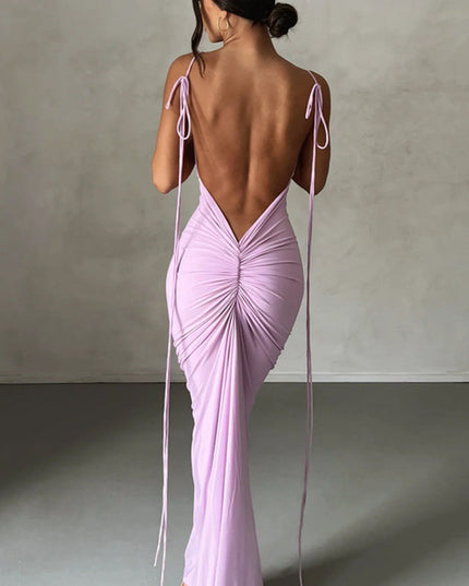 Back view of a women's pleated plunge neck backless maxi dress in light purple with tie straps