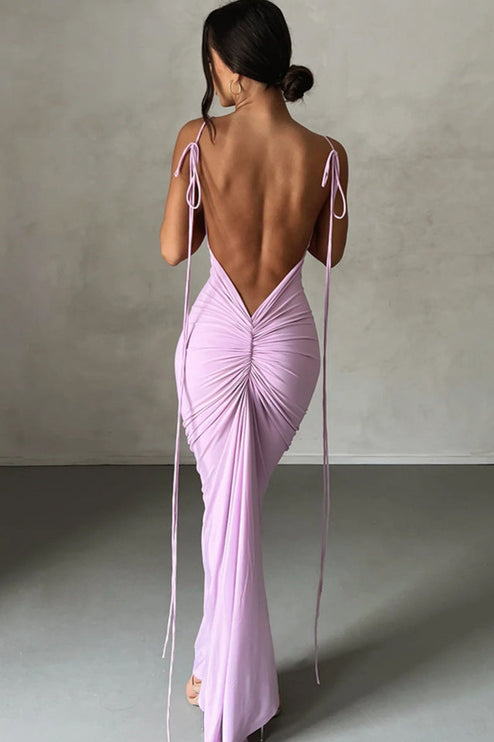 Back view of a women's pleated plunge neck backless maxi dress in light purple with tie straps
