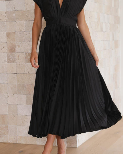 Front view of the black pleated v-neck midi dress, showcasing the full length and the intricate pleating of the skirt.