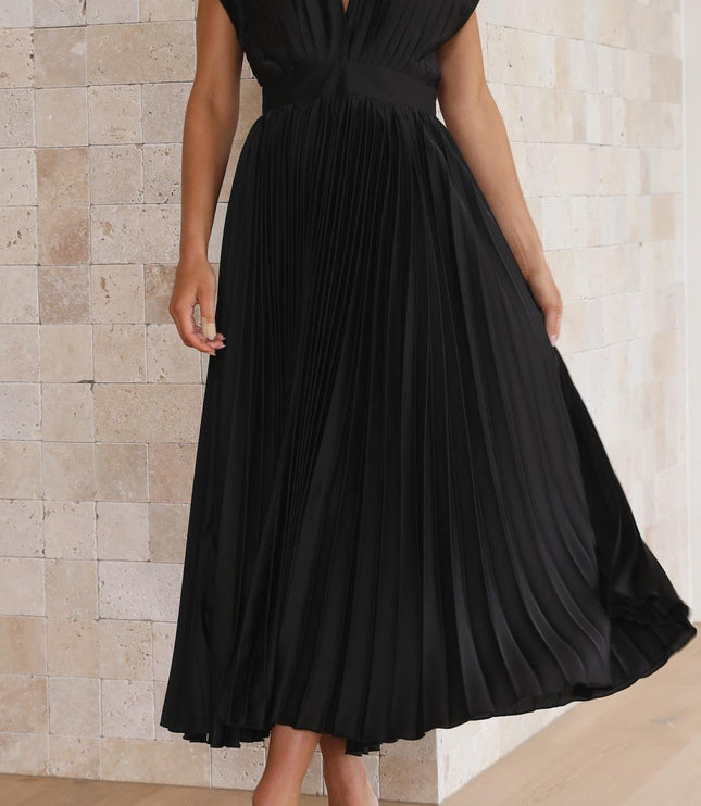 Front view of the black pleated v-neck midi dress, showcasing the full length and the intricate pleating of the skirt.