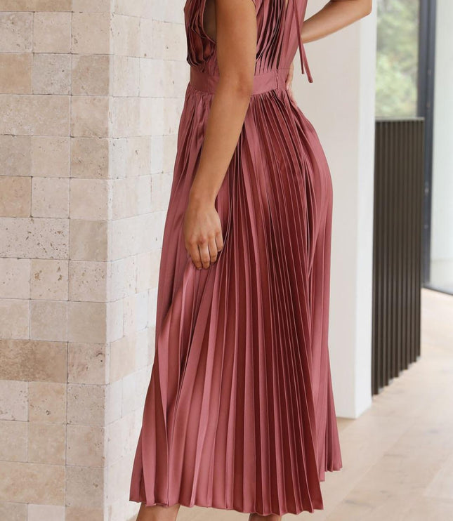Back view of a women's rose pleated v-neck midi dress, highlighting the pleated details and a tie-back closure.