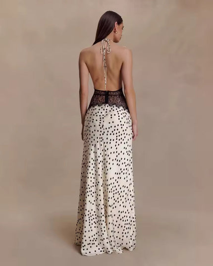 Back view of the women's polka dot halter neck lace maxi dress, highlighting the open back and black lace waist detail.
