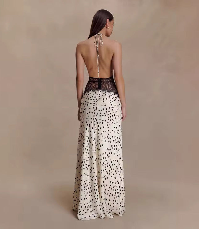 Back view of the women's polka dot halter neck lace maxi dress, highlighting the open back and black lace waist detail.