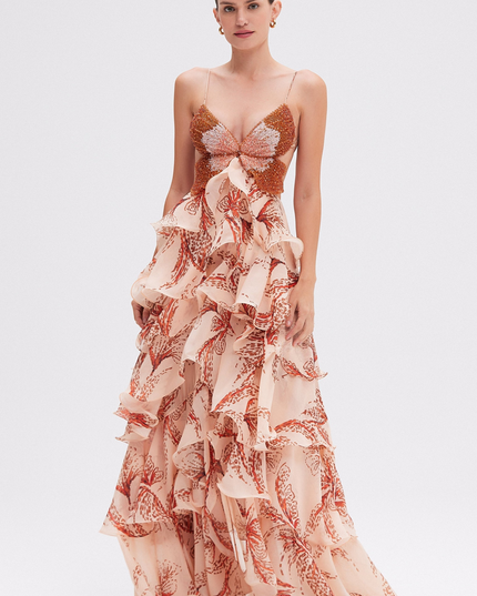Full-length women's prom maxi dress with beaded butterfly bodice and tiered ruffles in a light peach print.