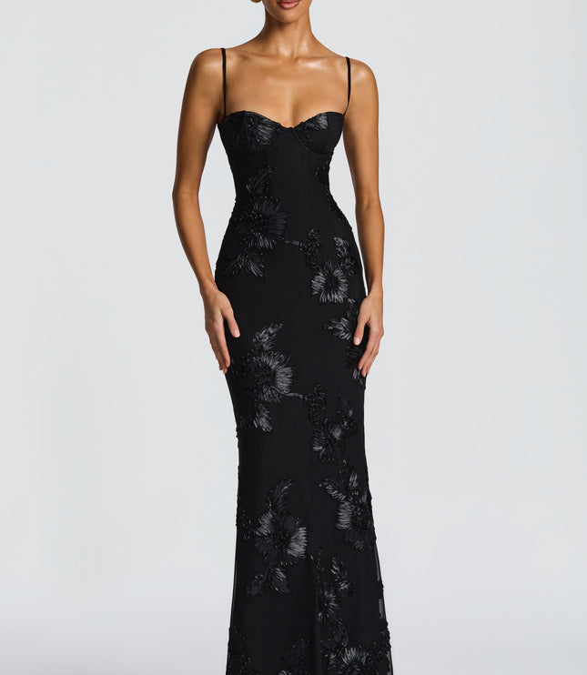 Front view of a black floral maxi dress featuring a sweetheart neckline and detailed floral embellishments throughout.