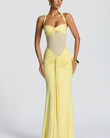 Women's light yellow prom halter neck ruched mesh maxi dress, designed with a sweetheart bust and a long, form-fitting skirt.
