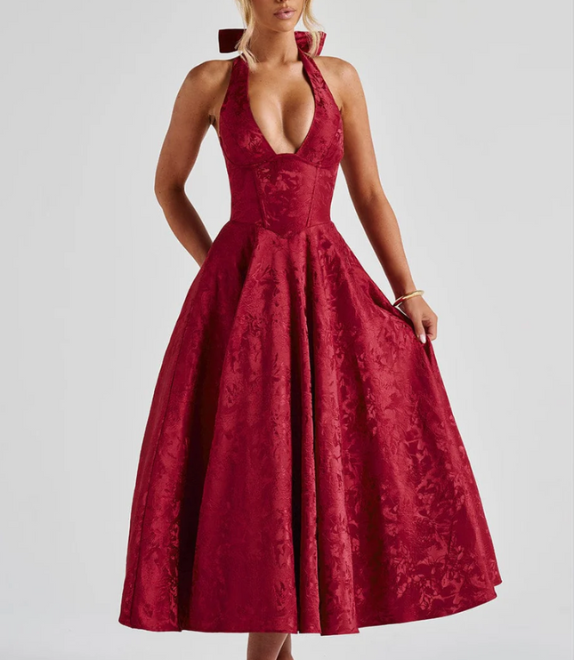 Red jacquard halter v-neck midi dress with a wide skirt and bow detail at the neck, front view.