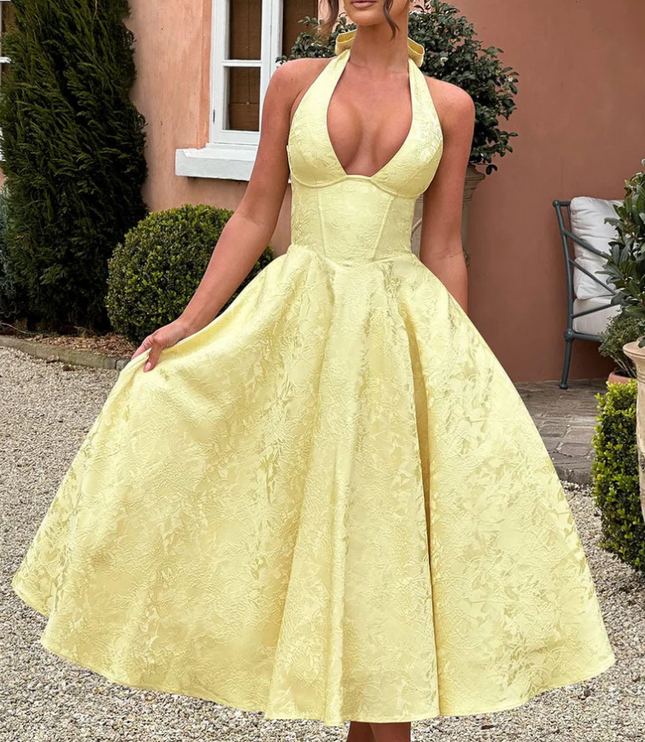 Yellow jacquard halter v-neck midi prom dress with full skirt and corset bodice detail, front view.