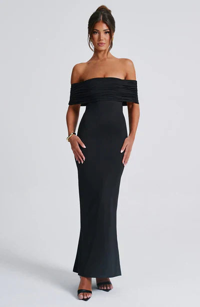 Black off-shoulder ruched maxi dress for women, featuring a fitted bodice and flowing skirt, for prom or evening wear.