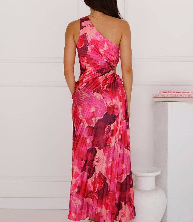 Back view of a women's one-shoulder cutout pleated maxi dress in a vibrant pink floral print, showcasing the elegant pleats and flowing skirt, for prom.