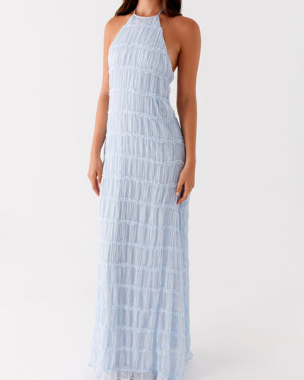 Full length front view of the light blue halter neck maxi dress, highlighting its elegant drape and texture.