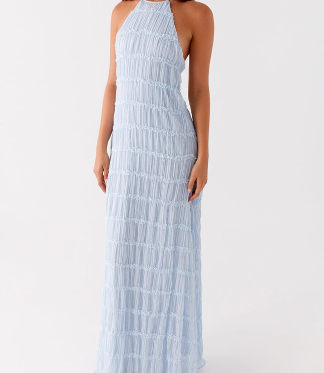 Full length front view of the light blue halter neck maxi dress, highlighting its elegant drape and texture.