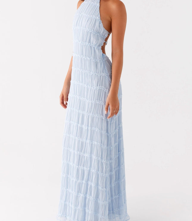 Light blue halter neck maxi dress with open back and ruched texture, for prom or formal events.
