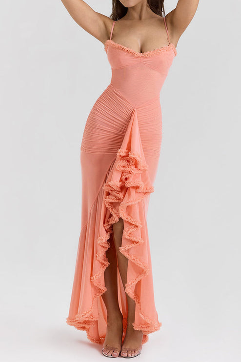 Full-length view of a peach women's prom ruffled front maxi dress with spaghetti straps and a body-hugging silhouette.