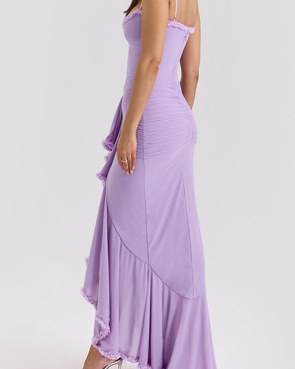 Side view of a light purple prom dress with cascading ruffles, ruched detailing, and a flowing skirt.
