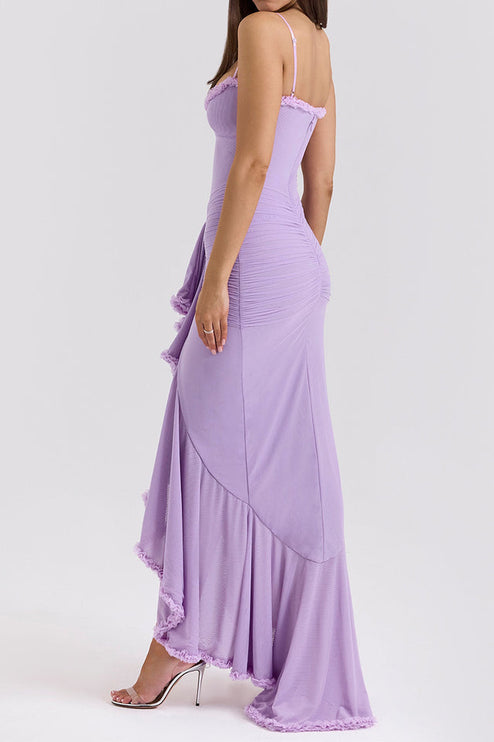 Side view of a light purple prom dress with cascading ruffles, ruched detailing, and a flowing skirt.