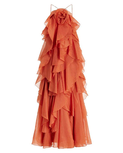 Full product shot of the coral strapless ruffle layered maxi dress from a slightly different angle, highlighting the tiered design and elegant silhouette.