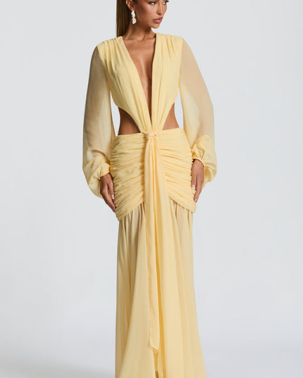 Full front view of a light yellow long sleeve V-neck cut-out maxi dress, ideal for prom or formal events.