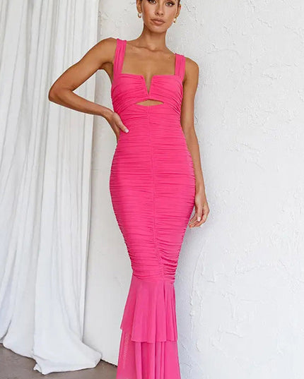 Full front view of a vibrant pink ruched fishtail maxi dress, featuring a V-neckline.