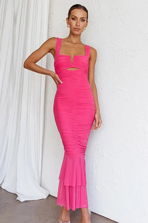 Full front view of a vibrant pink ruched fishtail maxi dress, featuring a V-neckline.