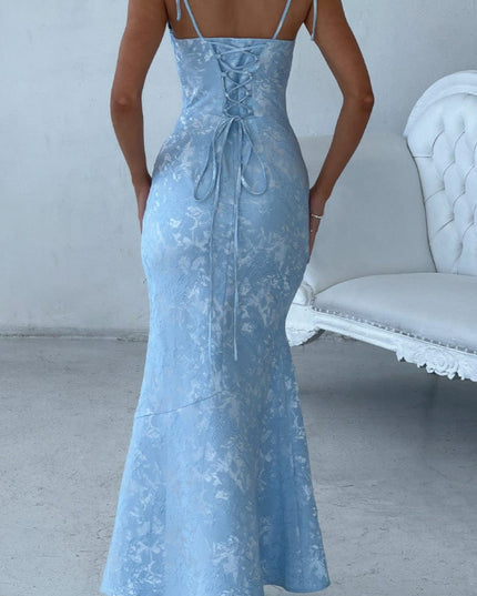 Rear view of light blue floral lace-up maxi dress, showcasing the intricate corset-style back detailing and mermaid hem.