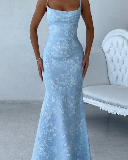 Light blue floral maxi dress for women, featuring delicate spaghetti straps and a mermaid silhouette, for a wedding guest.
