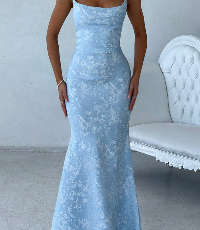Light blue floral maxi dress for women, featuring delicate spaghetti straps and a mermaid silhouette, for a wedding guest.