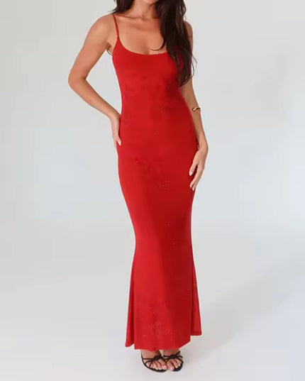 Full view of a red embellished scoop neck maxi dress, highlighting the floor-length design and subtle sparkle details.