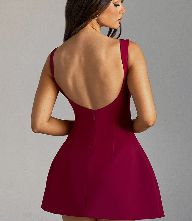 Side-back view of the red bubble mini dress, featuring the scoop back and short hemline.