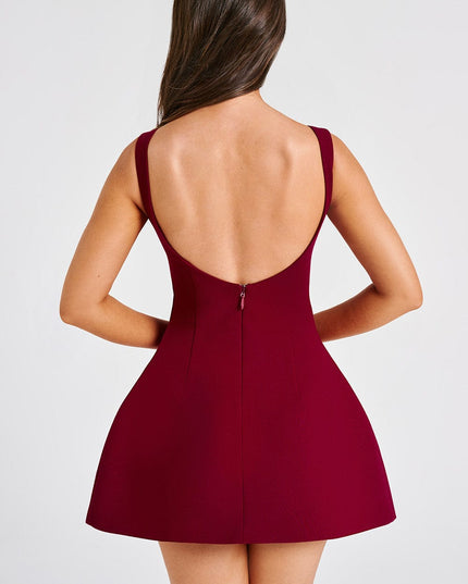 Back view of the red bubble mini dress on a white background, emphasizing the low scoop back and fitted waist.