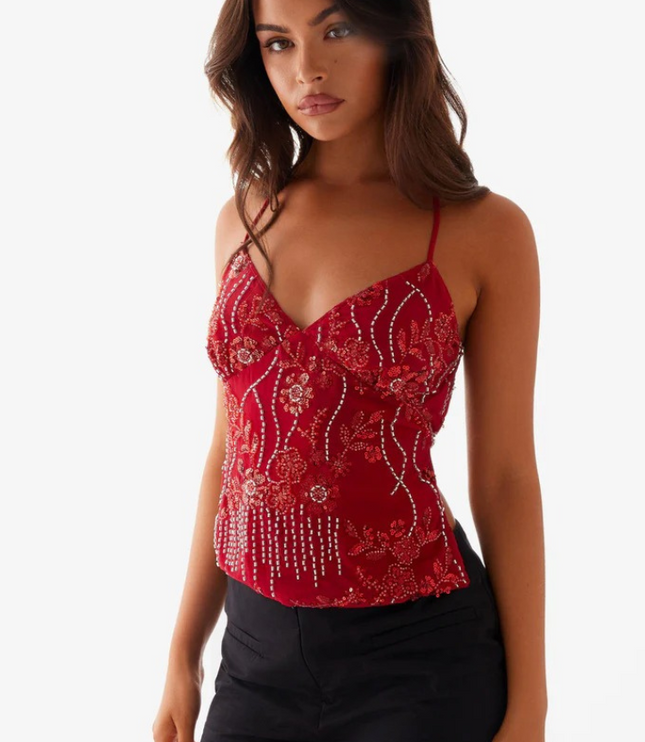 Side view of a red sequin V-neck party cami top featuring delicate floral and vertical beaded patterns.