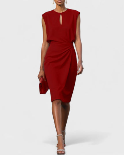Red round neck keyhole midi dress, sleeveless with a draped front, offering a bold look for wedding suits for women.