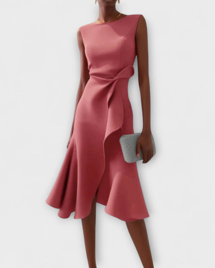 Stylish rose pink sleeveless midi dress for women, showcasing a draped asymmetric skirt and a cinched waist with ruffle detail.