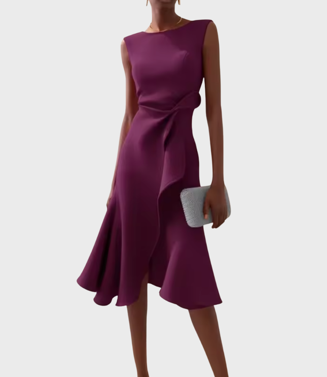 Deep plum sleeveless midi dress featuring a graceful draped asymmetric style, complete with a waist ruffle and a flared skirt.