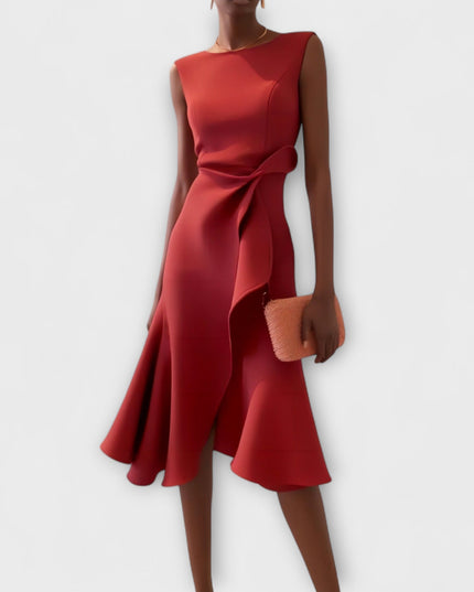 Sleeveless draped asymmetric midi dress in a rich red hue, featuring a ruffled waist detail and flared hem, for formal occasions.