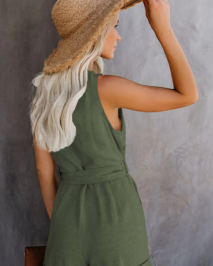 Back view of a women's sleeveless olive green V-neck romper with a tie waist and rolled shorts.