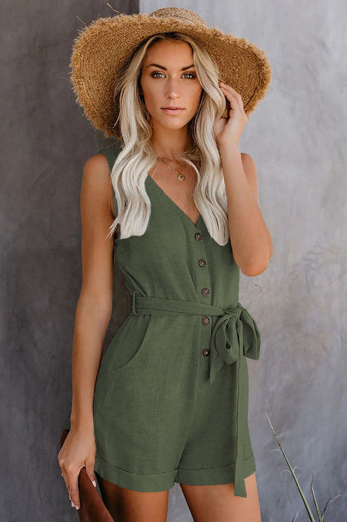 Front view of a women's sleeveless olive green V-neck romper with button details and a tie waist.