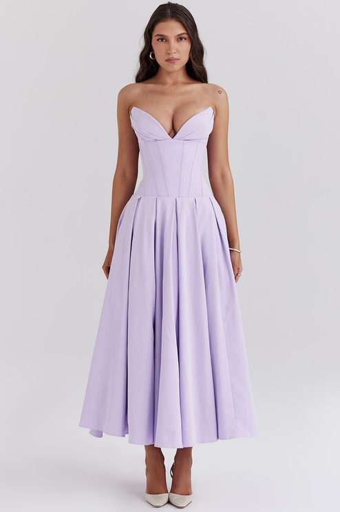 Full length view of a women's strapless boned bodice pleated midi dress in light lavender